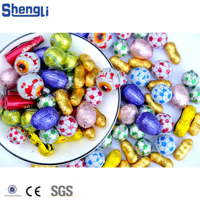 Funzione principale Spazzolatura sferica 300-500 ppm Macchina di imballaggio di uova di cioccolato per fogli di moneta automatici